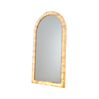 angle view of Calista arched oversized floor mirror with natural stone frame and warm LED backlighting