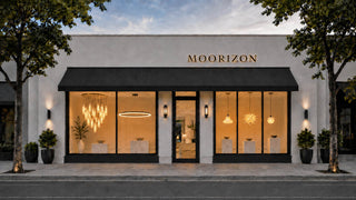 Moorizon store front with illuminated interior and decorative plants.