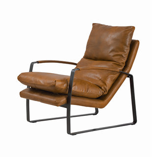 angle view of cognac leather lounge chair with black curved metal base