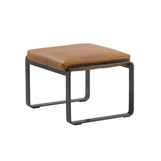 angle view of cognac leather lounge footstool with matte metal base