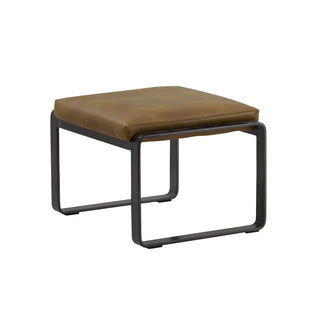 angle view of local brown leather lounge footstool with matte metal base