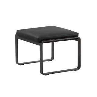 angle view of new black leather lounge footstool with matte metal base