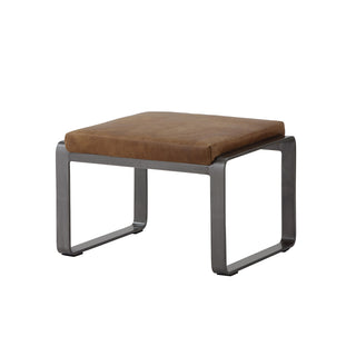 angle view of whiskey leather lounge footstool with matte metal base