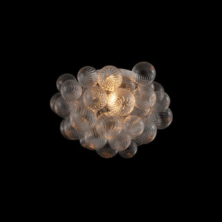 Modern bubble flush mount ceiling light on black background, sculptural cluster of glass balls