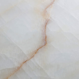 Top view of calcite coffee table showing natural stone veining and texture