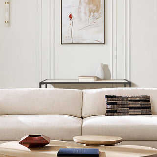 Interior view of entryway with calcite console table styled with decorative objects