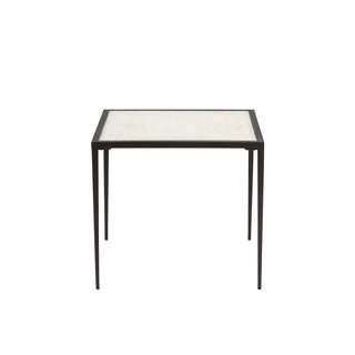 front view of modern white calcite side table with slim metal legs