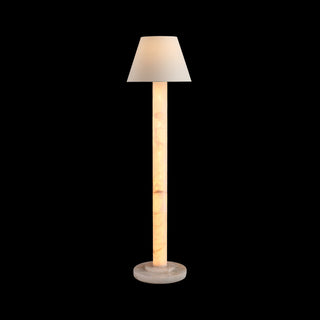Calista modern floor lamp on black background, warm illuminated stone column and soft fabric shade