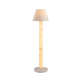 Calista modern floor lamp on white background, warm glowing stone column with neutral tapered shade