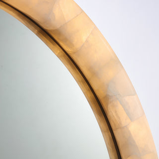 close up detail of calista large round LED mirror frame with golden natural stone