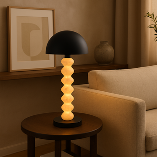 Calista sculptural table lamp on side table in warm living room, modern accent light with stacked sphere base