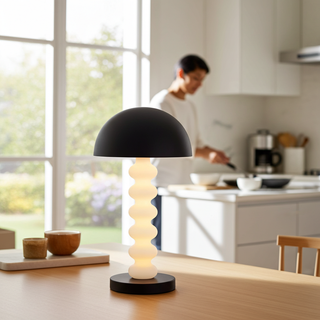 Calista sculptural table lamp on dining table by large window, modern decorative table lamp for minimalist interiors