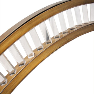 Close up of Celestial Orbit chandelier underside, layered brass rails and soft LED glow