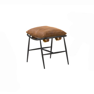 angled view of cognac leather footstool with metal frame legs