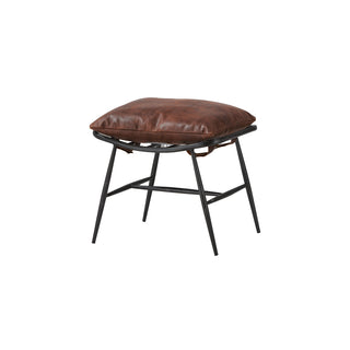 angled view of light brown leather footstool with vintage metal legs