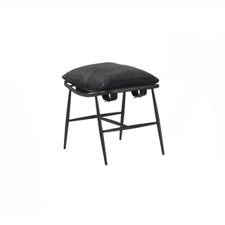 angled view of new black leather footstool with metal frame legs