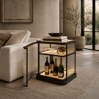 Gatsby Squared LED Bar Cabinet with illuminated glass rod sides, wine bottles, and glassware in a modern living room.