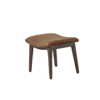 angle view of modern light brown leather lounge footstool with solid wood legs