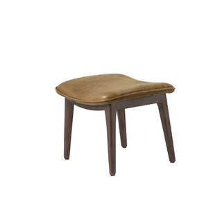 angle view of modern local brown leather lounge footstool with solid wood legs