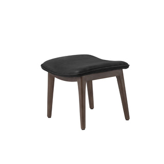 angle view of modern new black leather lounge footstool with solid wood legs