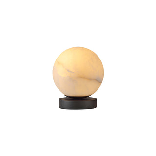 Moonlit Stone table lamp with a glowing selenite stone globe and matte black base against a white background
