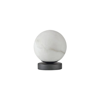 Moonlit Stone table lamp featuring a natural white selenite stone globe and matte black base, against a white background