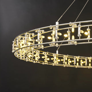 Lit close-up along the Aura halo, small bulbs glowing on short upright links between the upper and lower rails