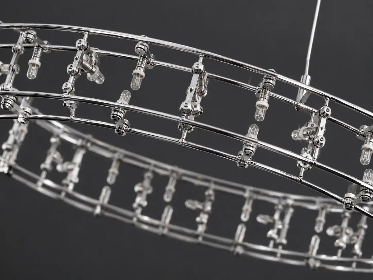 Unlit ring chandelier with clear LED bulbs and a slim, polished stainless steel frame against a dark gray background.