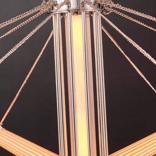 Illuminated central glass column with polished nickel framing and radiating arm-adjustment chains on the Moorizon Aurora chandelier.