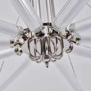 Underside close-up of the unlit Moorizon Aurora chandelier, showing ribbed glass arms and polished nickel pivot joints.