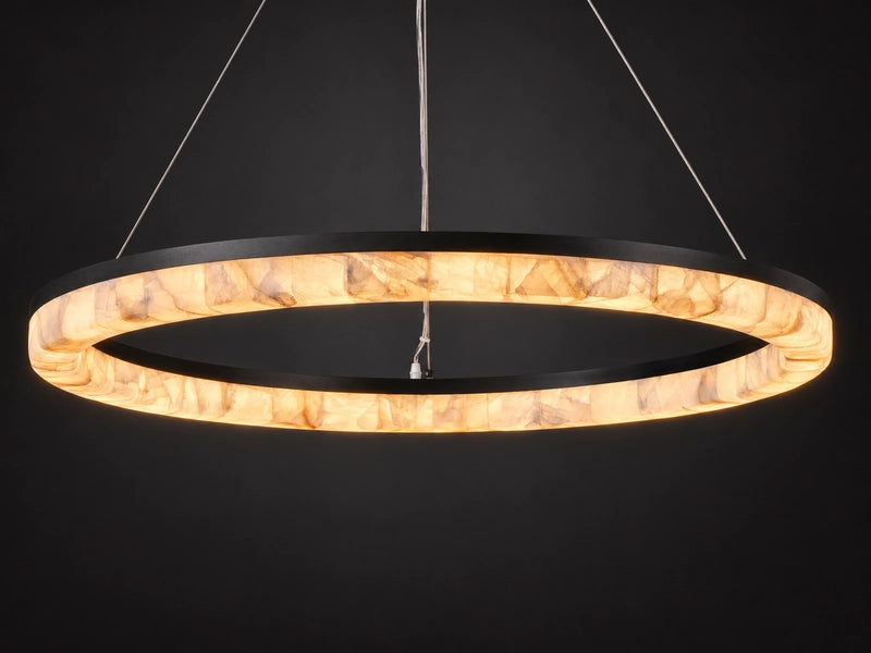 Calista Ring Calcite Stone Chandelier, lit: one continuous ring of glowing calcite in a black frame. Modern round stone chandelier