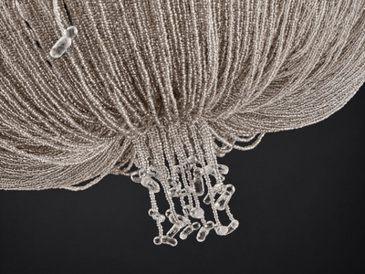 Underside of the Cascade chandelier: glass bead strands gather into a fringe of clear glass drops. Glass bead pendant light