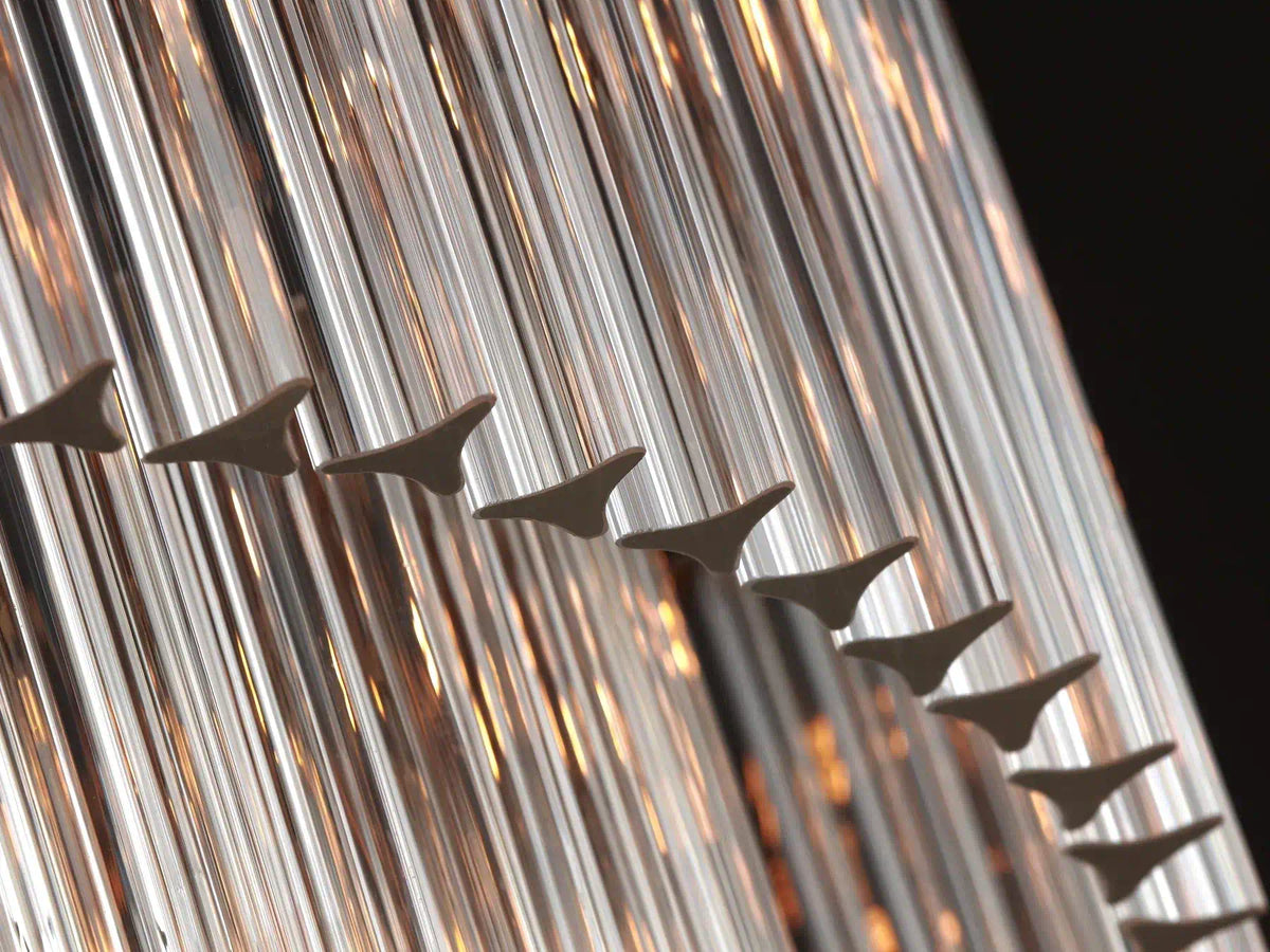 Close-up of the Marais Glass Chandelier’s triangular glass rods with three concave faces.