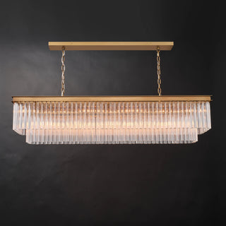 Front view of the illuminated Marais 60-inch rectangular glass chandelier on a black background, featuring tiered clear glass rods, a brass-finished metal frame, and warm light for dining rooms or kitchen islands.