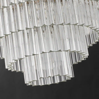 Underside of the unlit Marais chandelier, with flat-ended, three-sided glass rods arranged in tiers that narrow downward.