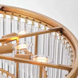 Inside the Marais chandelier, lit candle-shaped bulbs with glowing filaments sit on arms behind the glass rods.