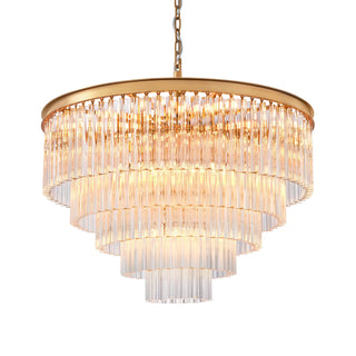 Marais five-tier glass rod chandelier with a round frame in Aged Brass finish, glowing with warm light.