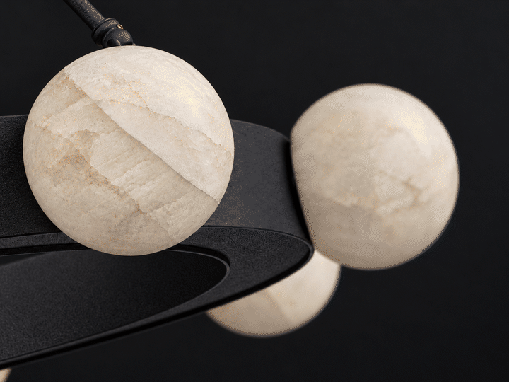 Dimmable calcite globe chandelier, close-up animation of two stone globes fading from full brightness to a low candle-like glow