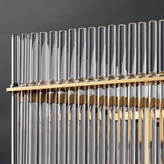 Unlit close-up of the Timelore chandelier, round glass rods with smooth tops rising above the frame edge