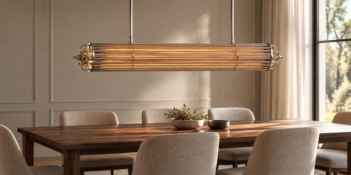 Urban Glow linear glass rod chandelier with smoked glass and nickel ends, lit over a long walnut dining table with linen chairs