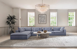 Moorizon Balance Collection blue fabric sofa with glass rod chandelier, elegant interior setup