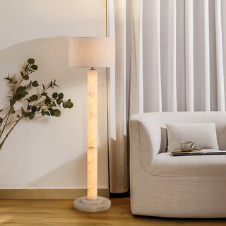 Moorizon Calista drum floor lamp glowing beside a sofa in a modern living room