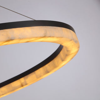 detail shot of Calista large chandelier’s ring construction and ambient light quality