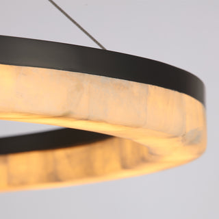 detail shot of illuminated stone ring with soft amber glow and precise craftsmanship