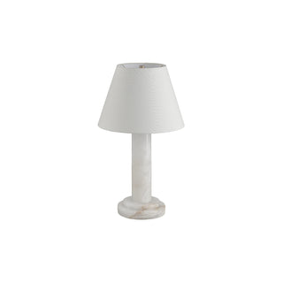Calista stone table lamp on white background with light off, neutral fabric drum shade