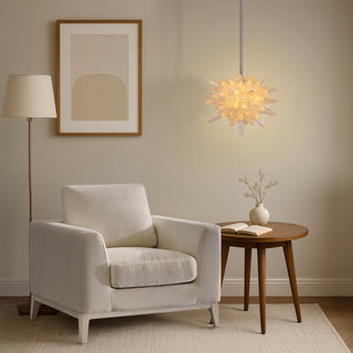 Crystalline Cluster small calcite pendant light with warm white glow and elegant era single seat sofa chair, Moorizon