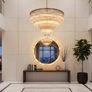 Marais large round chandelier with concave trihedral glass bars in an entryway.