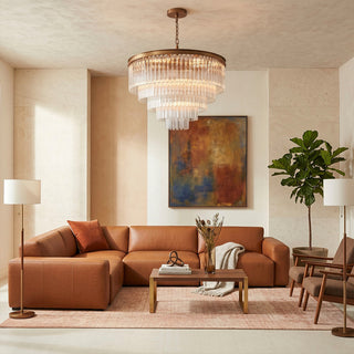Marais medium round chandelier with Murano-style trihedral glass bars in a living room.