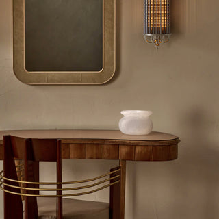 Natural calcite decorative vessel bowl styled on a wooden table and urban glow wall sconce, Moorizon