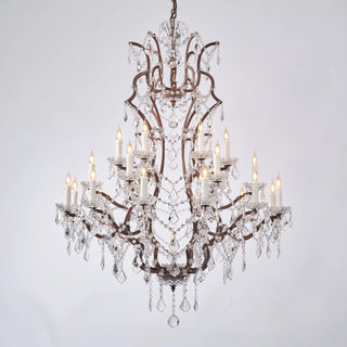 Warmly lit Moorizon Rustline 25-light crystal chandelier with candle-style bulbs, layered crystal drops, and antique-style iron arms on a white background
